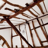 Wallrock hermal Liner on a cottage ceiling with beams 